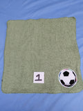 Green washcloth with an embellished soccer ball 
